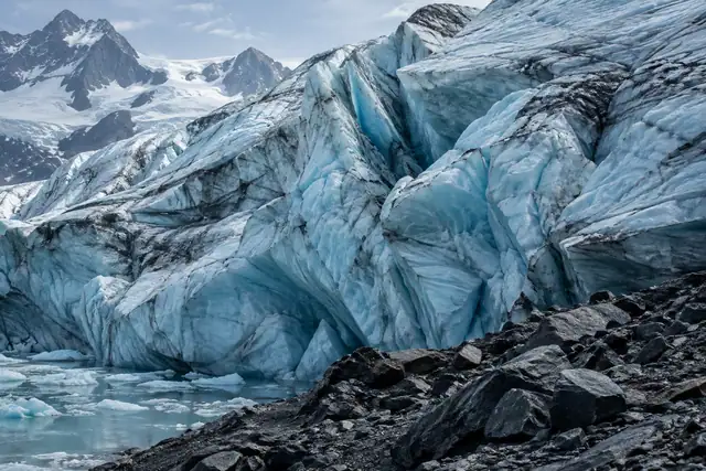 AI illustration: A medium detail view of pale blue-white glacier ice with natural compressed layers, a few shallow cracks.