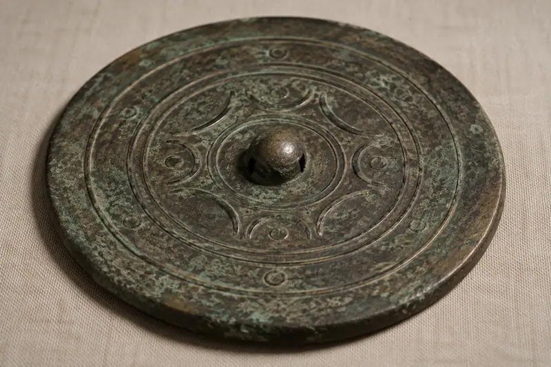 AI illustration: AI illustration: bronze mirror back; general category detail, not an actual photograph.