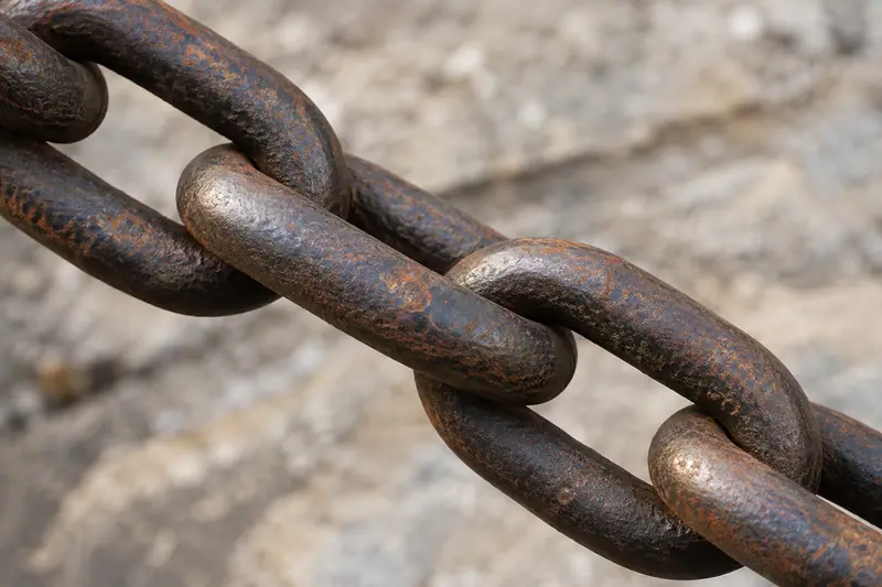 AI illustration: Weathered iron chain links.