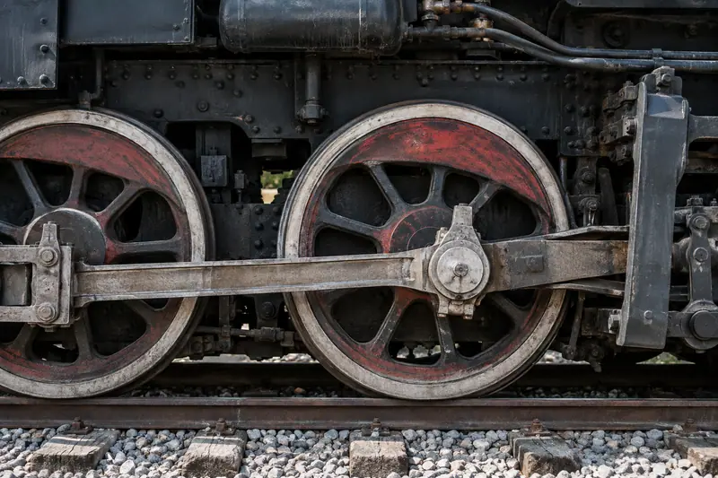 AI illustration: An old steam locomotive driving wheel, steel connecting rod and riveted black body above stationary rails.