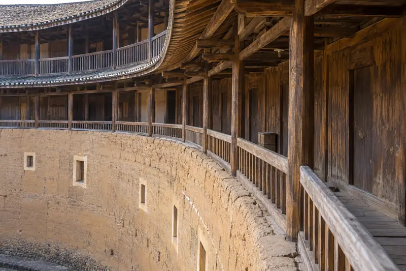 AI illustration: A medium architectural detail of a traditional Fujian tulou interior.