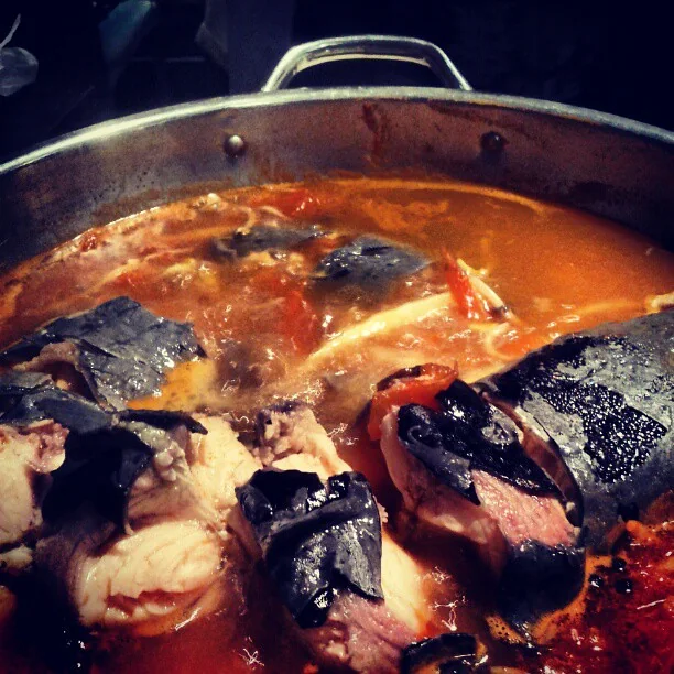 Fish pieces in a red sour broth, identified by the photographer as suantangyu; photographed in Beijing.