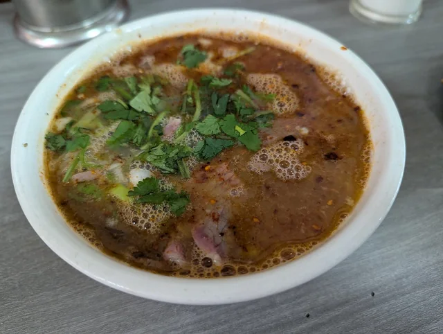 A bowl of beef soup with coriander, photographed in Luoyang in April 2025.