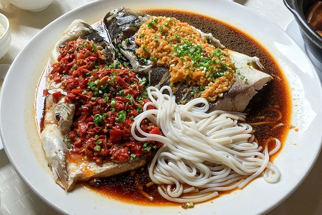 Photograph of Fish head with chopped chilies (剁椒鱼头).