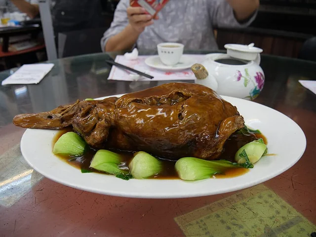 Whole eight-treasure duck with greens; this example was photographed at Lin Heung Kui in Hong Kong.
