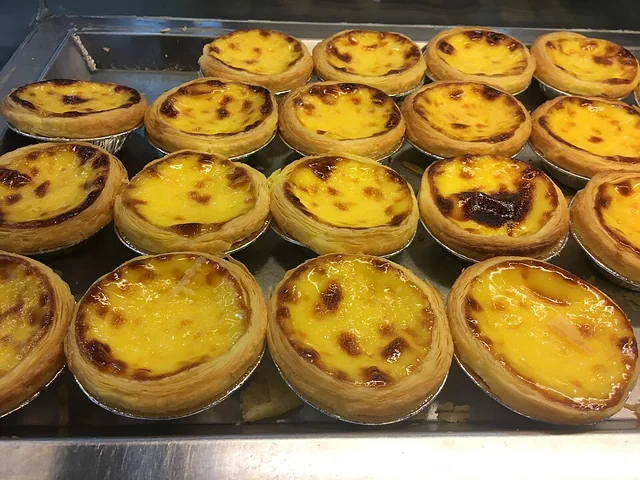Macau Portuguese-style egg tarts with browned custard tops.