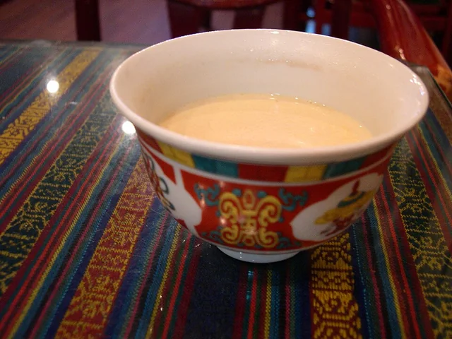 Tibetan butter tea served in a cup.