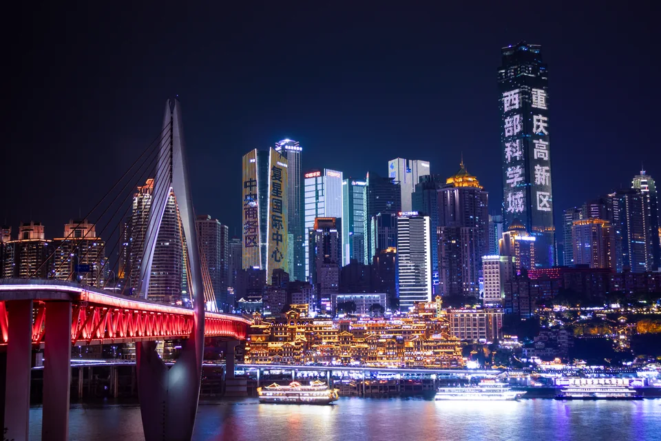 Chongqing skyline and Qiansimen Bridge at night