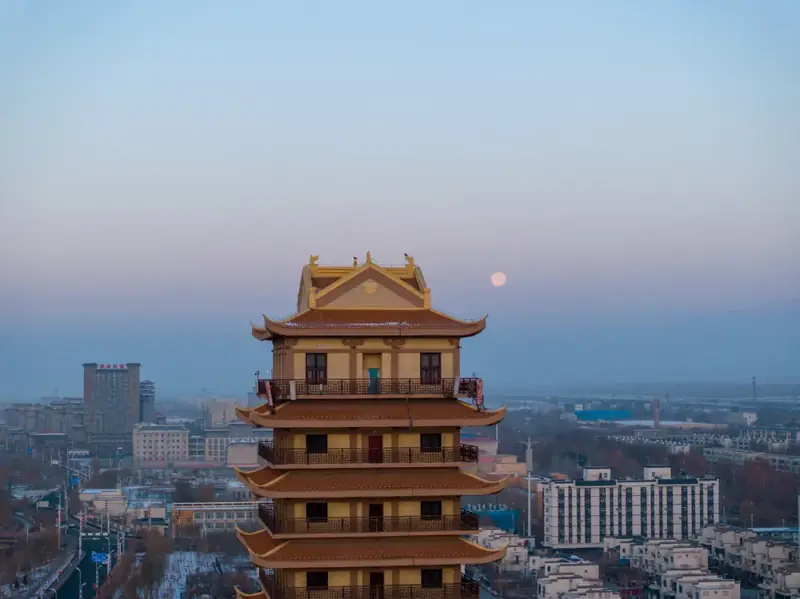 Tiemenguan City (铁门关市) — representative view · 城市街区中的多层仿古楼阁