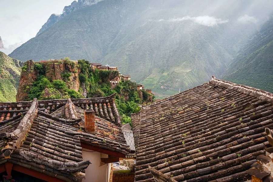 Tiled rooftops and the rocky setting of Baoshan Stone Village, Yunnan; 24 July 2018.