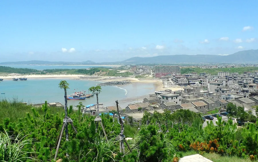 A beach, coastal settlement and bay on Pingtan Island, July 2011.