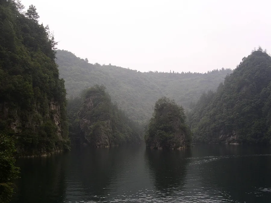 Baofeng Lake between wooded stone cliffs at Zhangjiajie, June 2006.