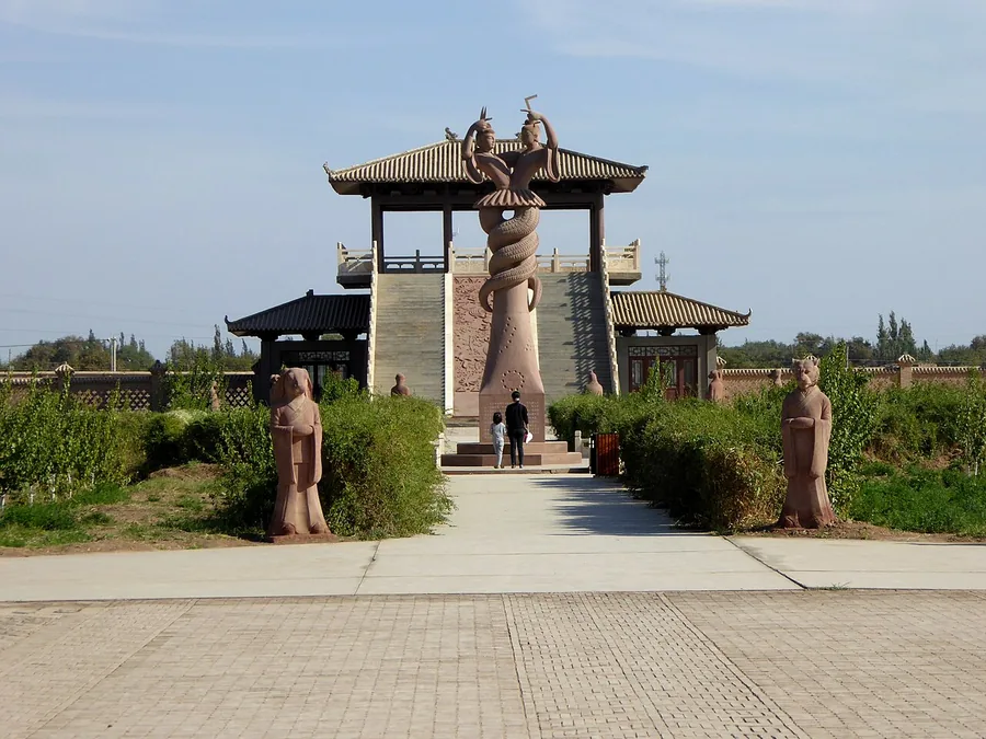 The visitor entrance and landscaped approach at the Astana Tombs, Turpan, Xinjiang; exact photograph date unknown (source upload recorded in November 2015).
