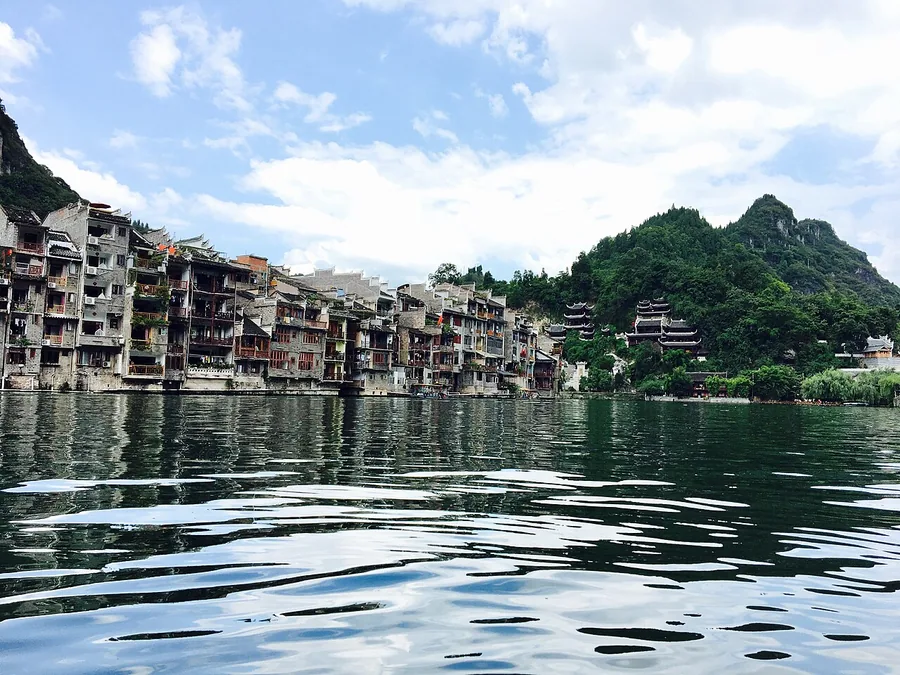 Riverside houses beside the Wuyang River in Zhenyuan old town, Guizhou. Photographed on 6 August 2017.