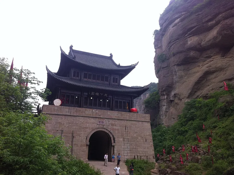 The reconstructed gate tower at Jianmen Pass beneath the surrounding cliffs. Photographed on 13 May 2012.