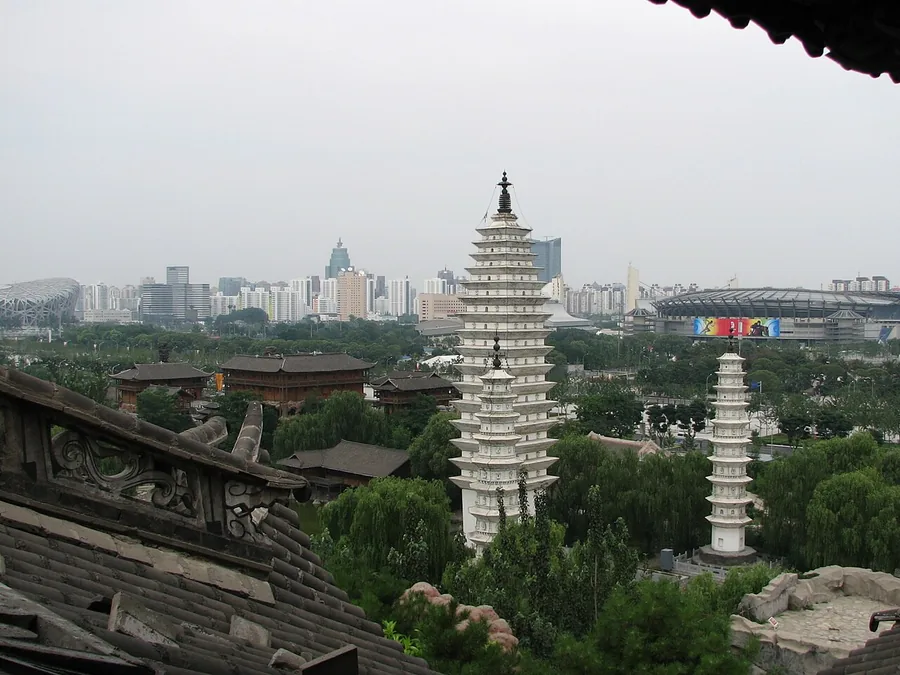 A white pagoda and architectural displays inside Beijing's China Ethnic Museum.