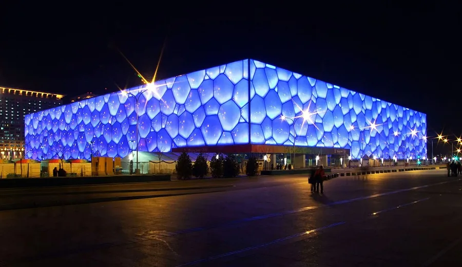 The illuminated blue exterior of Beijing's National Aquatics Center, the Water Cube, in January 2009.