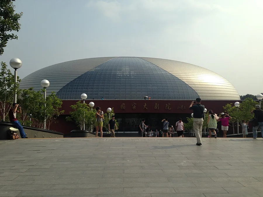 The domed National Centre for the Performing Arts in Beijing seen from its entrance approach.