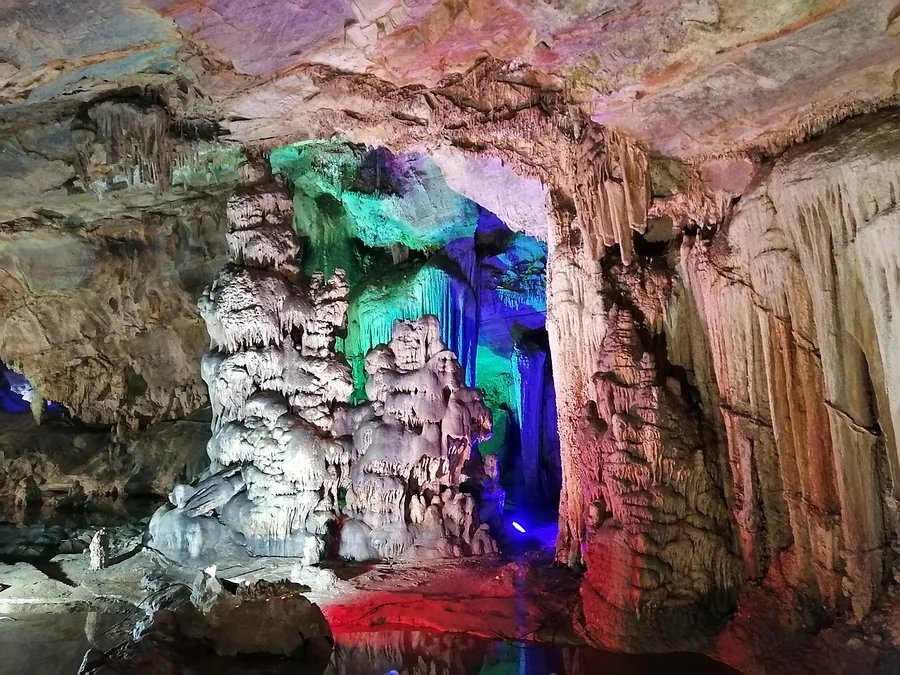 Illuminated limestone formations inside Shihuadong Cave in Beijing's Fangshan District.
