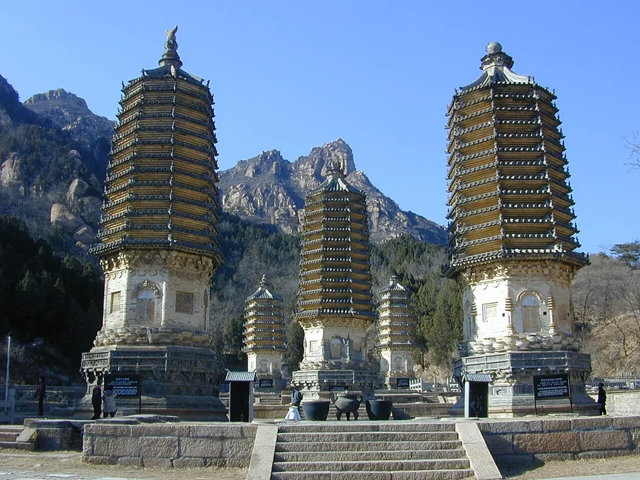 Historic pagodas against the mountains at Beijing's Yinshan Pagoda Forest.