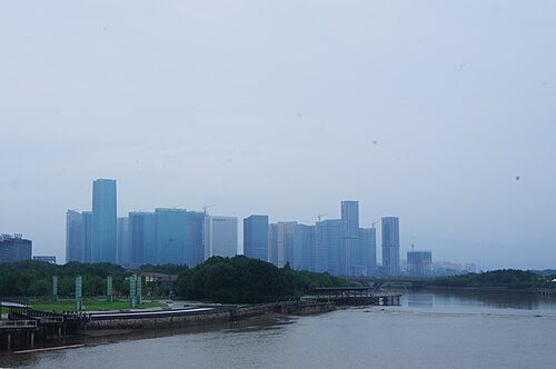 Distant overview of Yiwu International Trade City from across the river, photographed in 2017.
