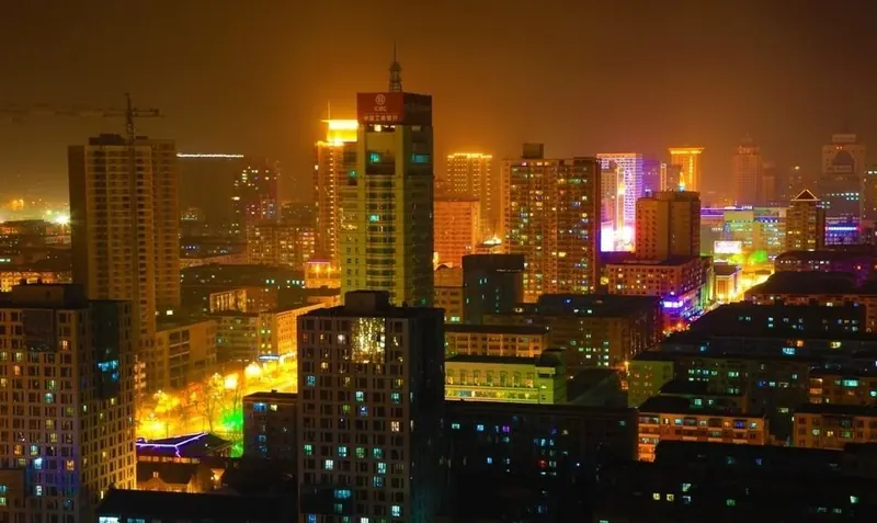 Mudanjiang's urban skyline at night (牡丹江), photographed in June 2012.