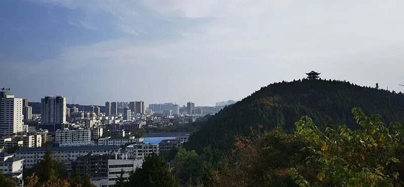 Langguang Pavilion and Jingmen's urban area (荆门岚光阁), viewed from Xishan Park in October 2021.