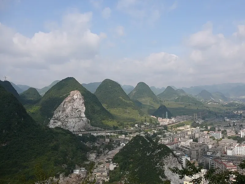 Liupanshui's urban area and nearby karst hills (六盘水), photographed in August 2007.