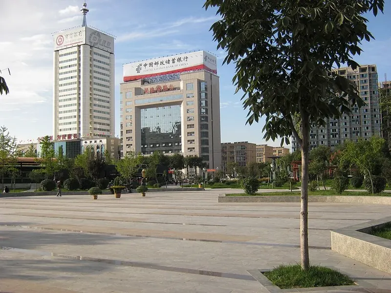An urban square in Weinan (渭南), with commercial buildings around its edges.