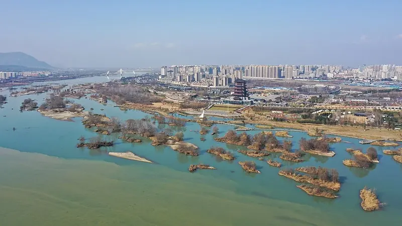 Hanzhong's urban skyline (汉中), viewed westward from the Dahekan side in December 2021.