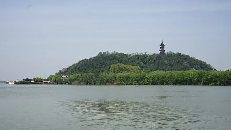 Jiaoshan and its pagoda viewed across the water.