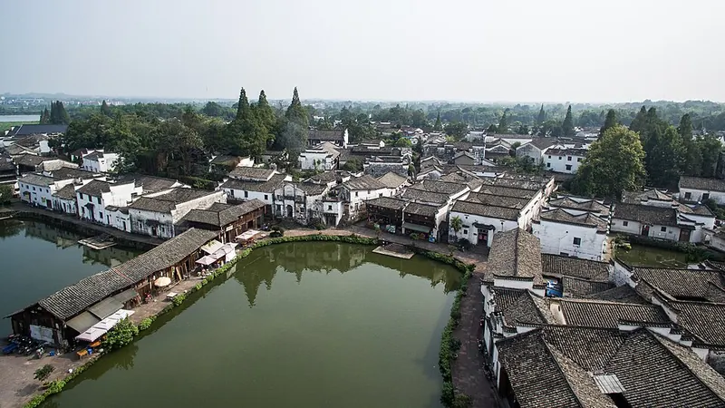 Traditional roofs and a village pond at Zhuge Village, Lanxi.