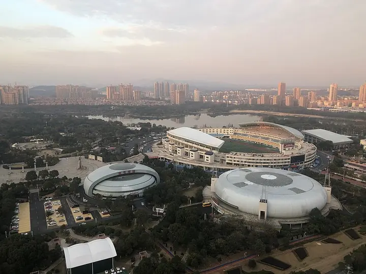Sports facilities and surrounding neighbourhoods seen from a high-rise building in Xinyu.
