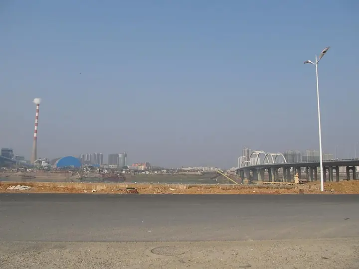 An avenue and sports buildings in Tianyuan District, Zhuzhou. Photo: Taken on 5 February 2011.