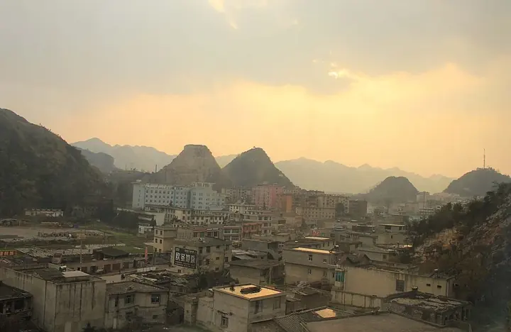 Houses and karst hills in Liuzhi Special District, Guizhou. Photo: 2011-03-28.