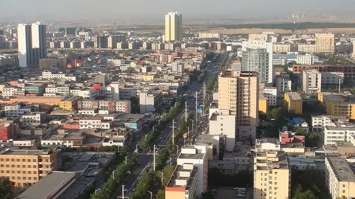 An elevated view of avenues and neighbourhoods in Xinshi District, Urumqi. Photo: Taken on 20 June 2011.
