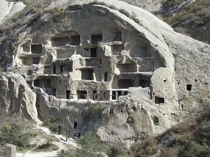 The rock-cut dwellings and cliff face at Guyaju Ruins in Yanqing District, Beijing. Photo: Taken in November 2004.
