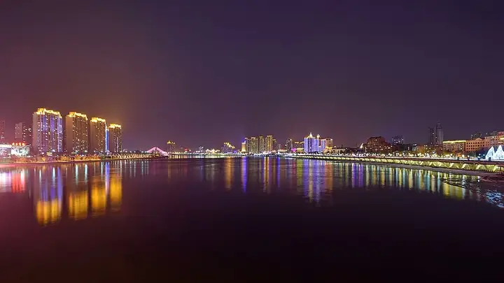 The Songhua River at night, with Fengman District on the left and Chuanying District on the right, seen from Jilin Bridge. Photo: 2017.