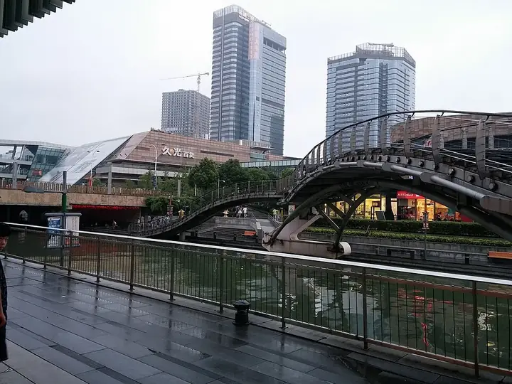 An arched pedestrian bridge and canal-side buildings in Wuzhong District, Suzhou. Photo: Taken on 23 August 2015.