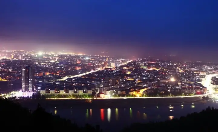 The illuminated county town and waterfront of Xixia at night. Photo: 2011-05-02.