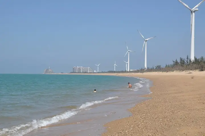 The beach and coastal wind turbines at Basuo in Dongfang, Hainan. Photo: Taken on 2 February 2014.