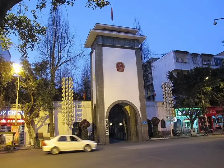 The entrance tower and streetfront of the Qianwei County government compound at dusk. Photo: Taken on 30 December 2012.