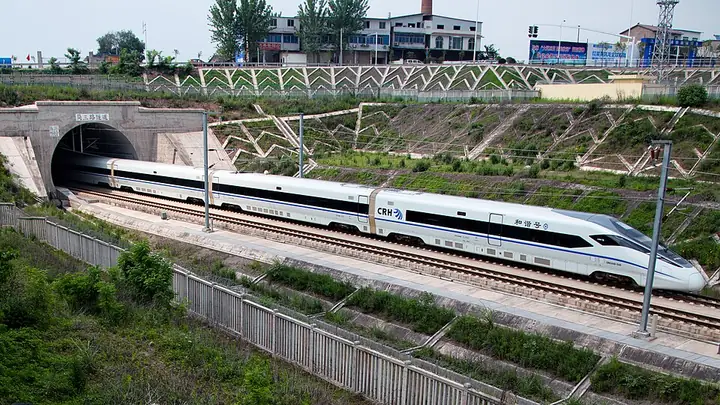 A high-speed train beside the Jiansan Road railway tunnel in Jianyang, Sichuan.