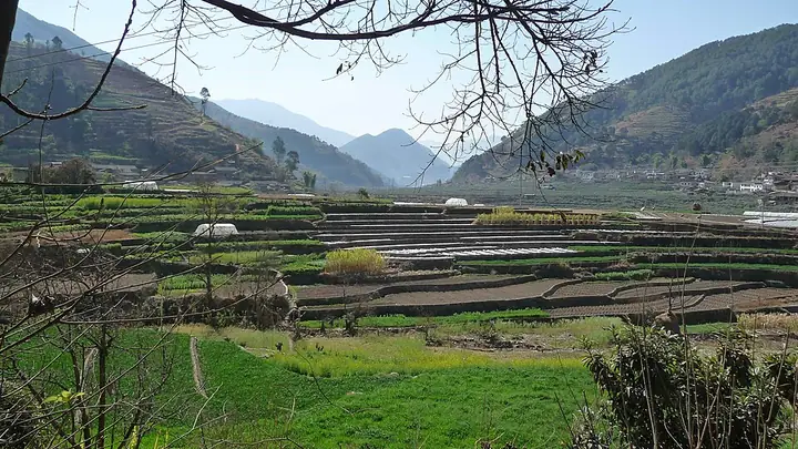 Fields and a mountain valley at Xiaoping village in Yanbian County.