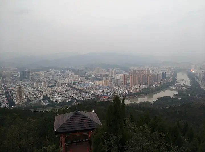 The urban area of Lizhou District, Guangyuan, seen from a hillside pavilion.