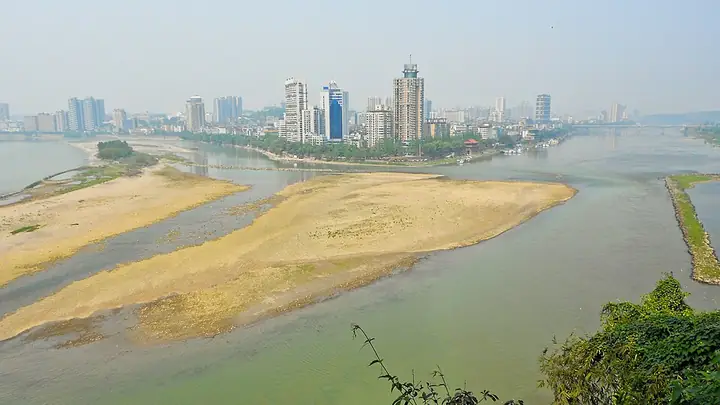 The Xiaogongzui river confluence and Leshan waterfront in Shizhong District, viewed from the Giant Buddha side of the river.