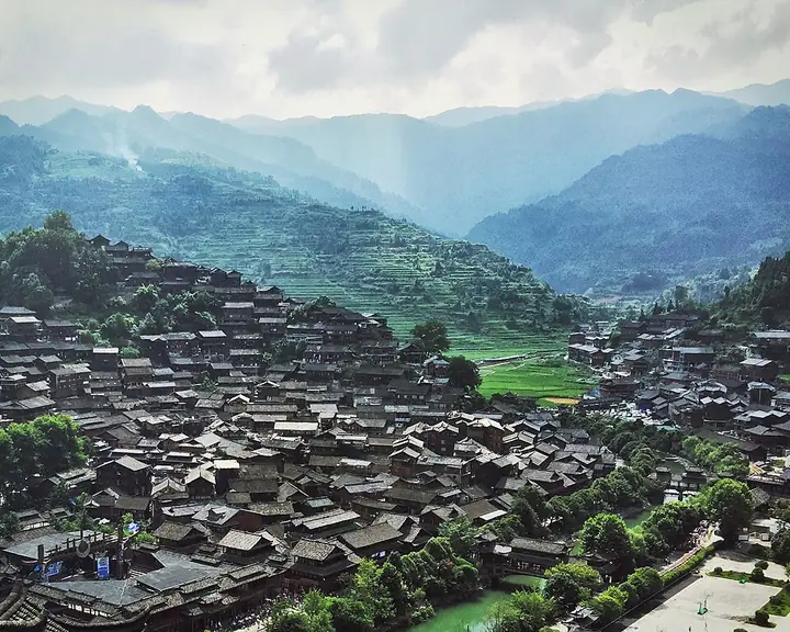 The hillside wooden houses of Xijiang Miao Village in Leishan County, within Qiandongnan prefecture.