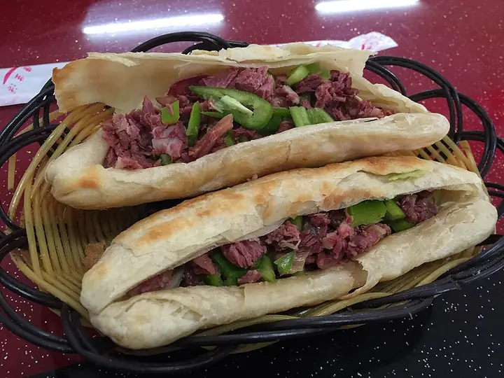 Hejian-style donkey huoshao with green pepper, photographed in Beijing.