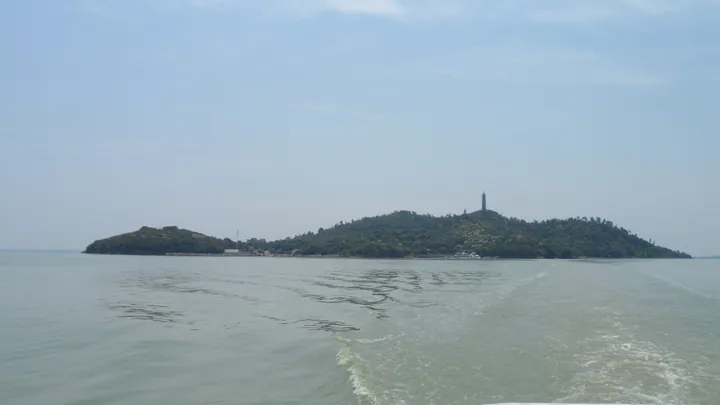 View of Laoshan Island island and its pagoda from a boat on Chao Lake