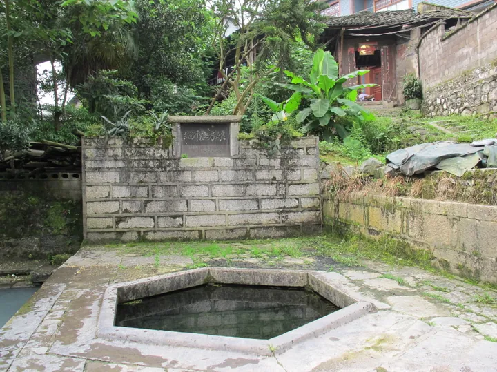 Ancient well and traditional houses at Longtan Ancient Town, Youyang County